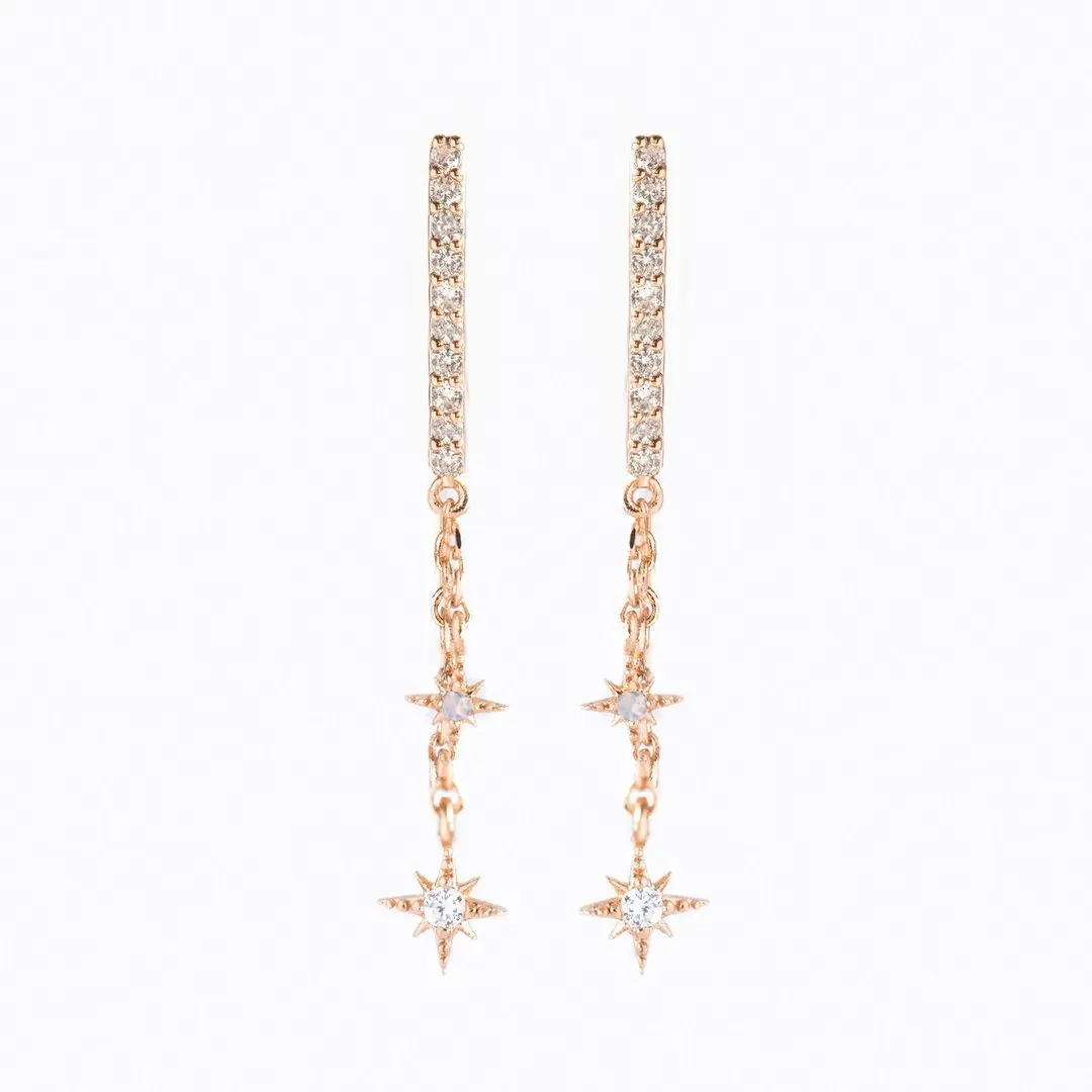 Boucles d'oreilles pendantes étoiles et cristaux dorées